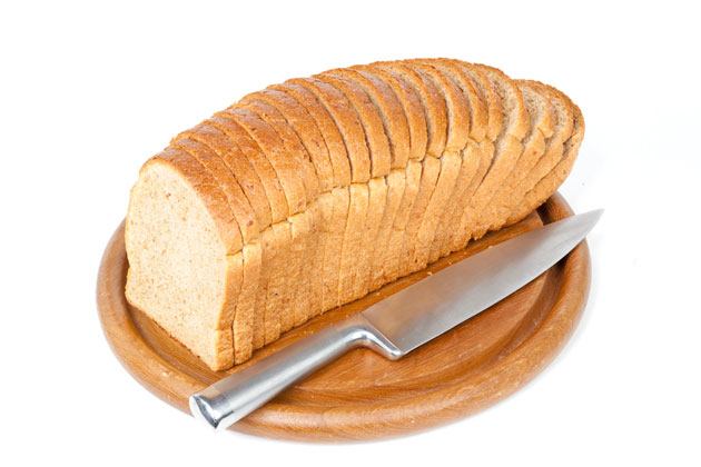 Slicing pieces of bread cutting large pieces of bread